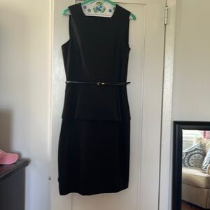Black staple dress for work or at night. Knee length